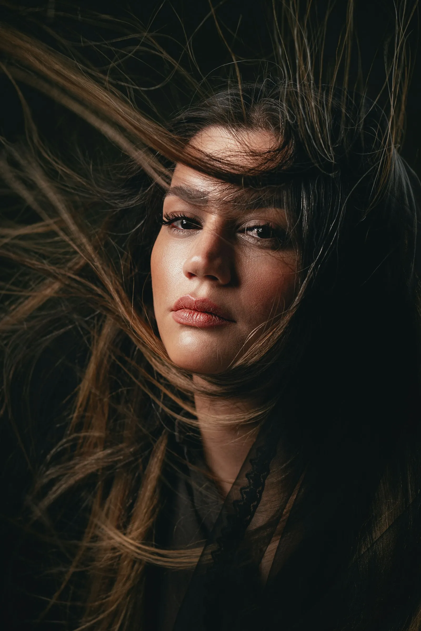 Woman with long glossy hair in motion