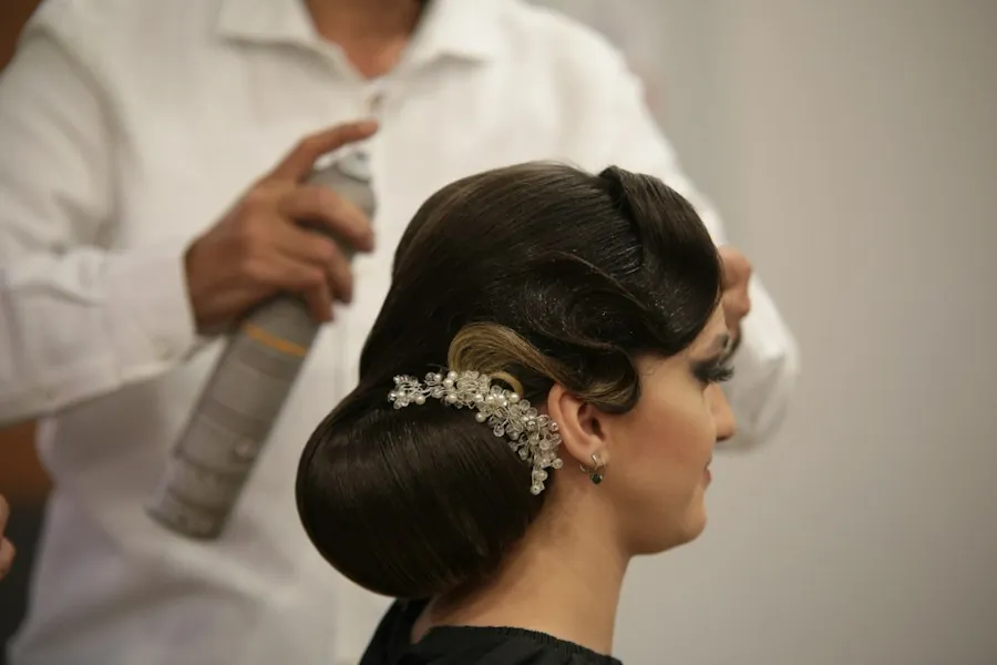 Sleek bridal updo with crystal pin